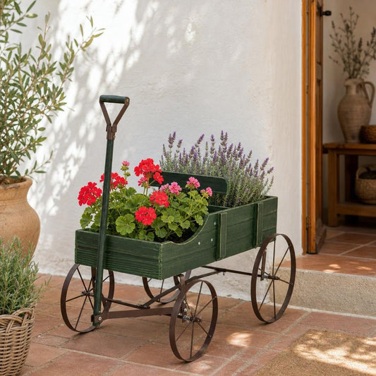 Carrito macetero de madera con geranios junto a una puerta